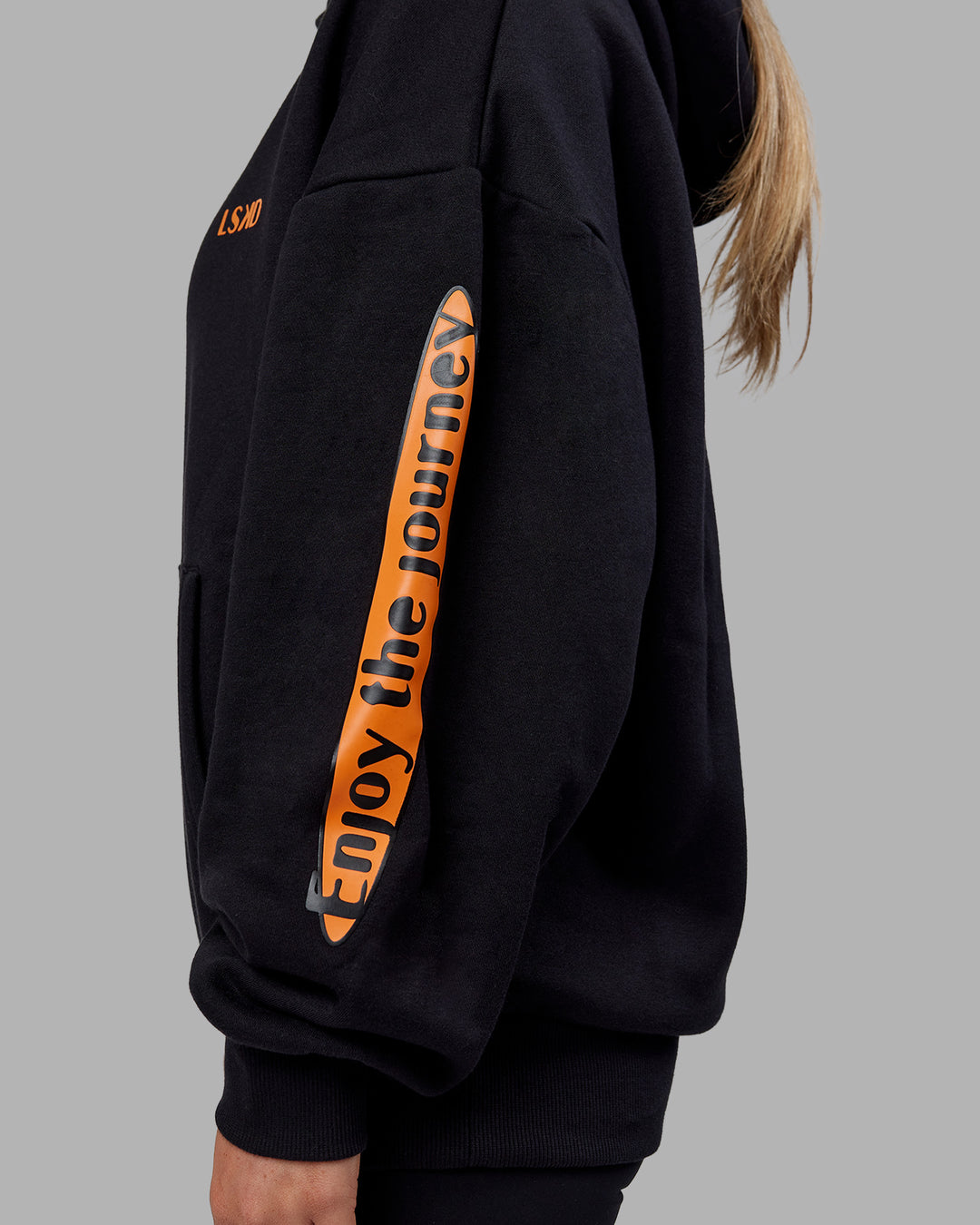 Woman wearing Hyped Unisex Oversized Hoodie - Black-Vibrant Orange | Model:Neve | Size:XS - view 14
