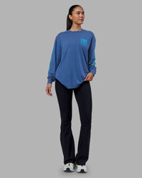 Woman wearing Inferno Journey FLXCotton Oversized Long Sleeve Tee - Midnight Blue-Blue Bird | Model:Rhiley | Size:XS | Thumbnail Index: 13