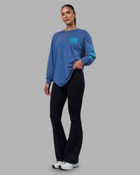Woman wearing Inferno Journey FLXCotton Oversized Long Sleeve Tee - Midnight Blue-Blue Bird | Model:Rhiley | Size:XS | Thumbnail Index: 5