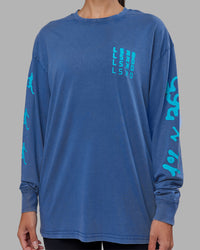 Woman wearing Inferno Journey FLXCotton Oversized Long Sleeve Tee - Midnight Blue-Blue Bird | Model:Rhiley | Size:XS | Thumbnail Index: 8