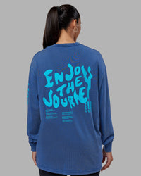 Woman wearing Inferno Journey FLXCotton Oversized Long Sleeve Tee - Midnight Blue-Blue Bird | Model:Rhiley | Size:XS | Thumbnail Index: 9