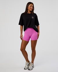Woman wearing Inferno Journey FLXCotton Oversized Tee - Black-Ultra Fuchsia | Model:Bianca | Size:XS | Thumbnail Index: 7