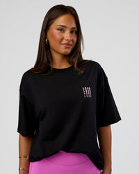 Woman wearing Inferno Journey FLXCotton Oversized Tee - Black-Ultra Fuchsia | Model:Bianca | Size:XS | Thumbnail Index: 4