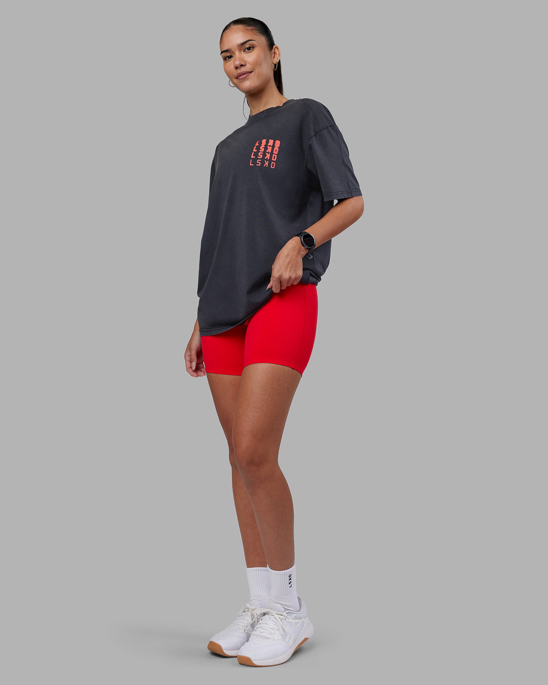 Woman wearing Inferno Journey FLXCotton Oversized Tee - Black Washed-Ultra Orange | Model:Rhiley | Size:XS - view 7
