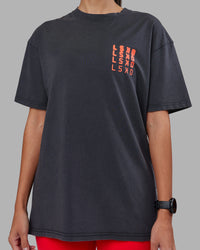 Woman wearing Inferno Journey FLXCotton Oversized Tee - Black Washed-Ultra Orange | Model:Rhiley | Size:XS | Thumbnail Index: 10