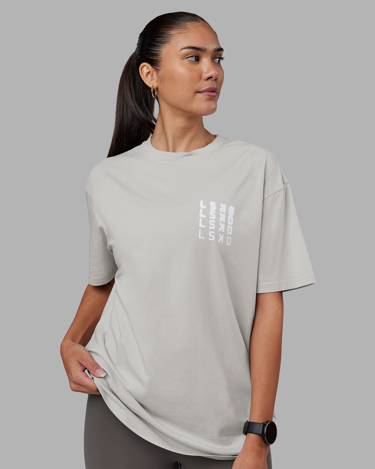 Woman wearing Inferno Journey FLXCotton Oversized Tee - Digital Mist Washed-White | Model:Rhiley | Size:XS