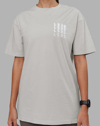 Woman wearing Inferno Journey FLXCotton Oversized Tee - Digital Mist Washed-White | Model:Rhiley | Size:XS | Thumbnail Index: 7