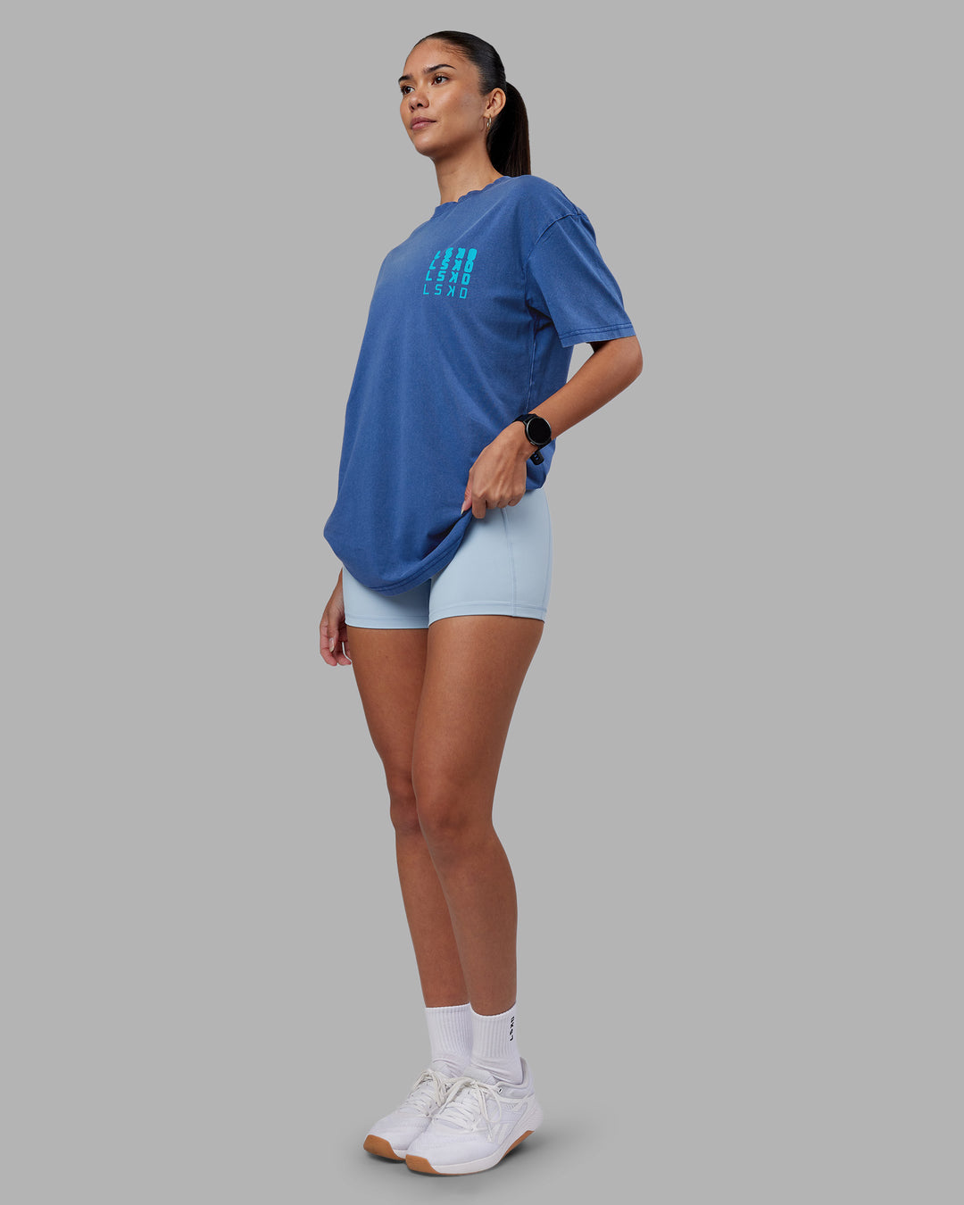 Woman wearing Inferno Journey FLXCotton Oversized Tee - Midnight Blue Washed-Blue | Model:Rhiley | Size:XS - view 10