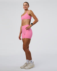 Woman wearing Interstellar Sports Bra - Candy Pink | Model:Emelia | Size:XS | Thumbnail Index: 3