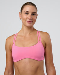 Woman wearing Interstellar Sports Bra - Candy Pink | Model:Emelia | Size:XS | Thumbnail Index: 0