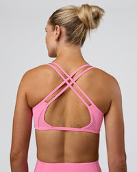 Woman wearing Interstellar Sports Bra - Candy Pink | Model:Emelia | Size:XS | Thumbnail Index: 4