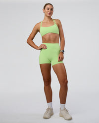 Woman wearing Interstellar Sports Bra - Solar Lime | Model:Emelia | Size:XS | Thumbnail Index: 4