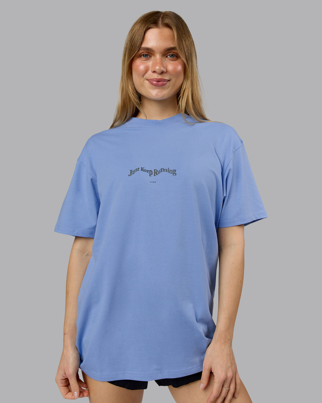 Woman wearing Just Run FLXCotton Oversized Tee - Soft Blue-Dark Storm | Model:Emilie | Size:XS - view 3