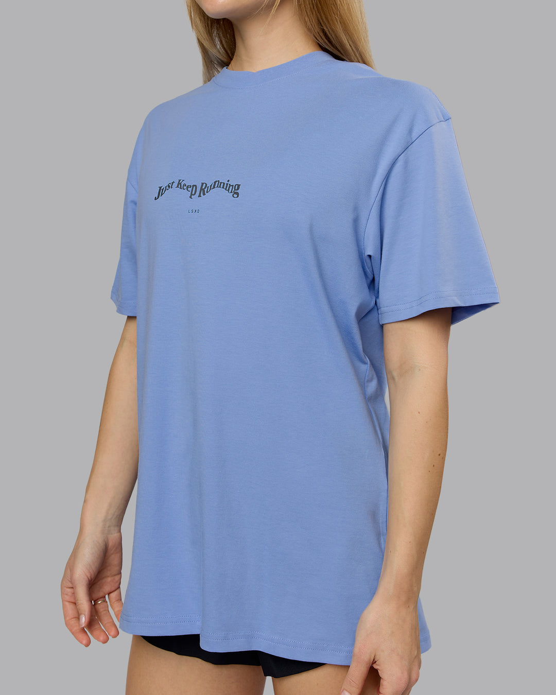 Woman wearing Just Run FLXCotton Oversized Tee - Soft Blue-Dark Storm | Model:Emilie | Size:XS - view 10