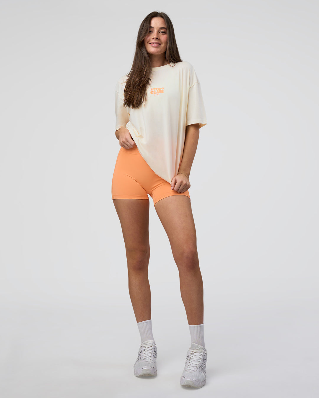 Woman wearing Kettle B FLXCotton Oversized Tee - Sugar Swizzle-Cantaloupe | Model:Estella | Size:XS - view 6