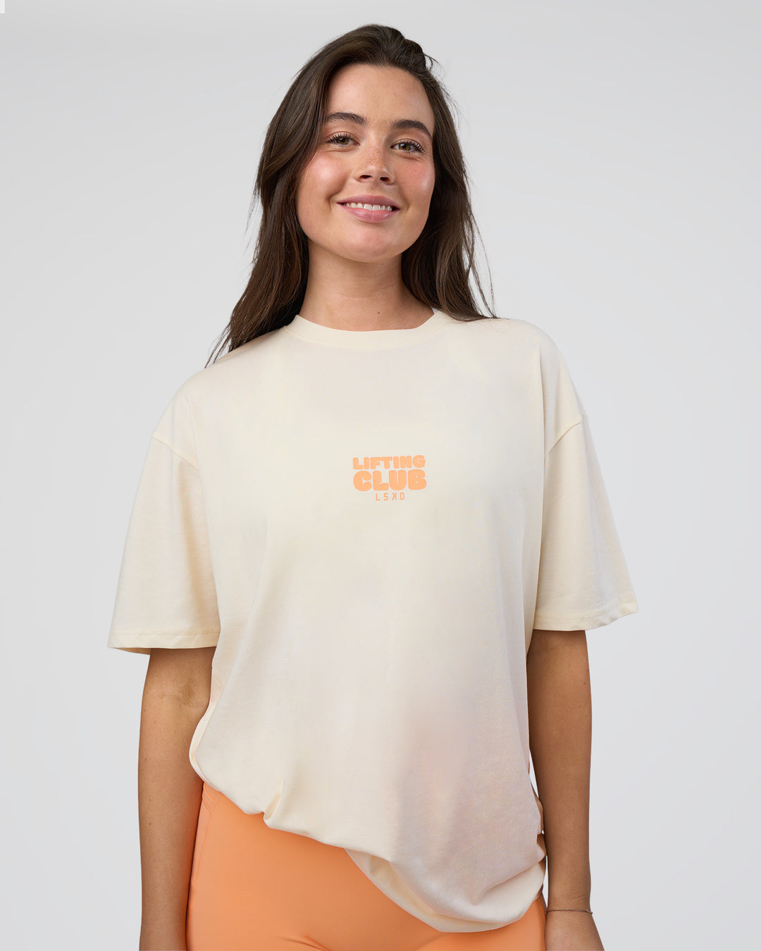 Woman wearing Kettle B FLXCotton Oversized Tee - Sugar Swizzle-Cantaloupe | Model:Estella | Size:XS - view 5