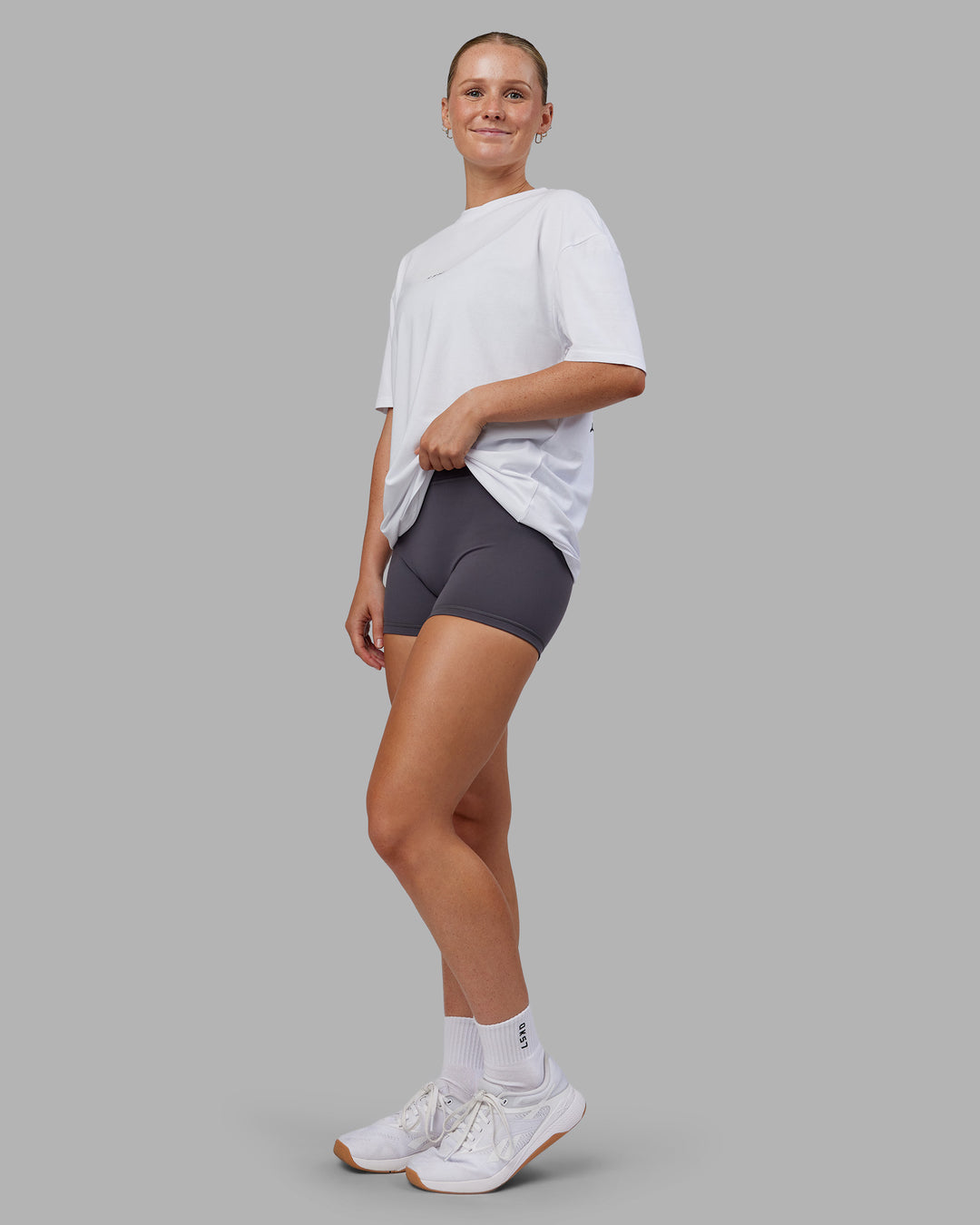 Woman wearing Kettlebell FLXCotton Oversized Tee - White-Black | Model:Neve | Size:XS - view 11