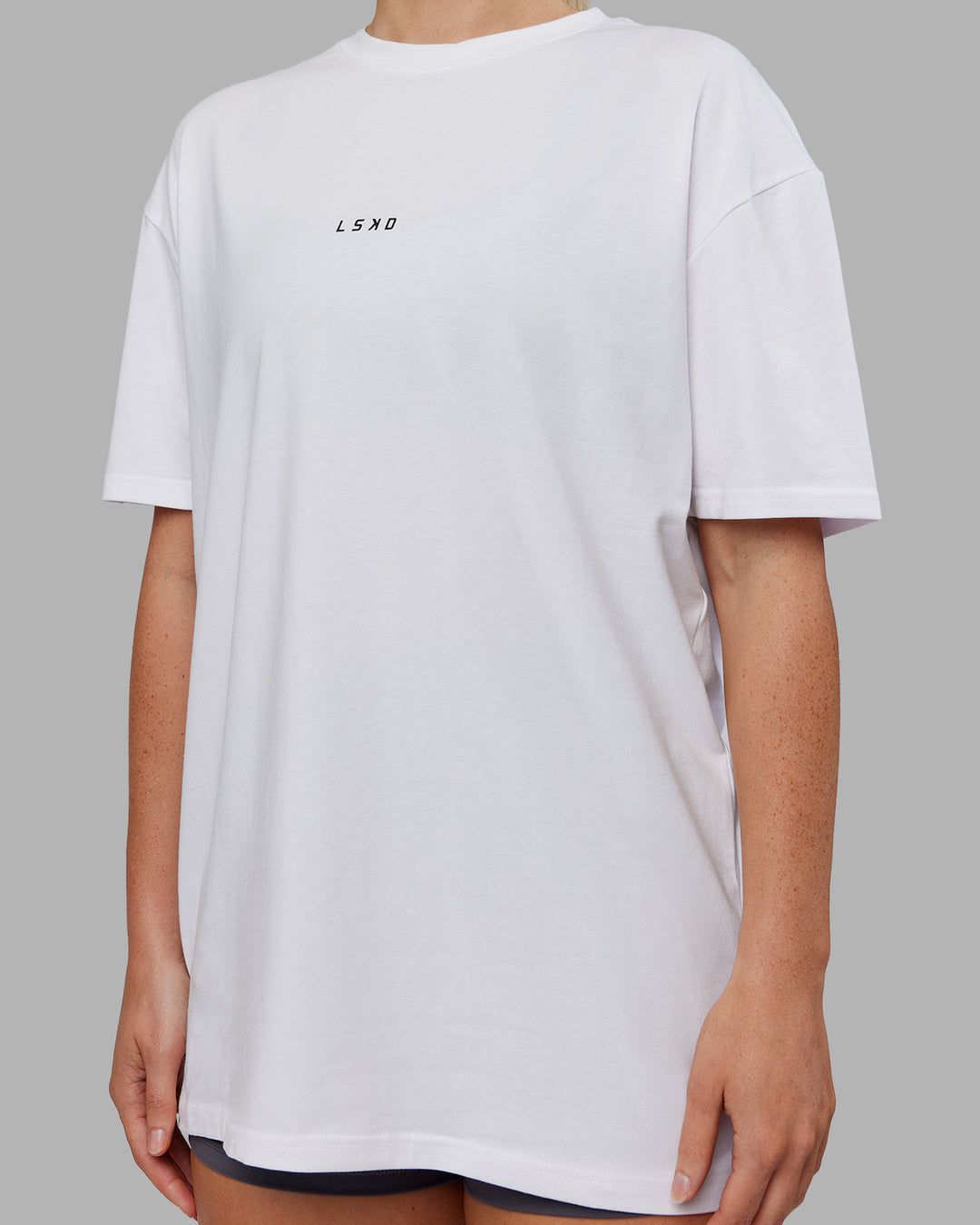 Woman wearing Kettlebell FLXCotton Oversized Tee - White-Black | Model:Neve | Size:XS - view 8
