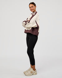 Woman wearing LSKD Fitness Club Oversized Sweater - Off White-Cocoa Powder | Model:Brylee | Size:XS | Thumbnail Index: 5
