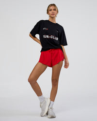 Woman wearing LSKD Run Club FLXCotton Oversized Tee - Black-White | Model:Leilani | Size:XS | Thumbnail Index: 8
