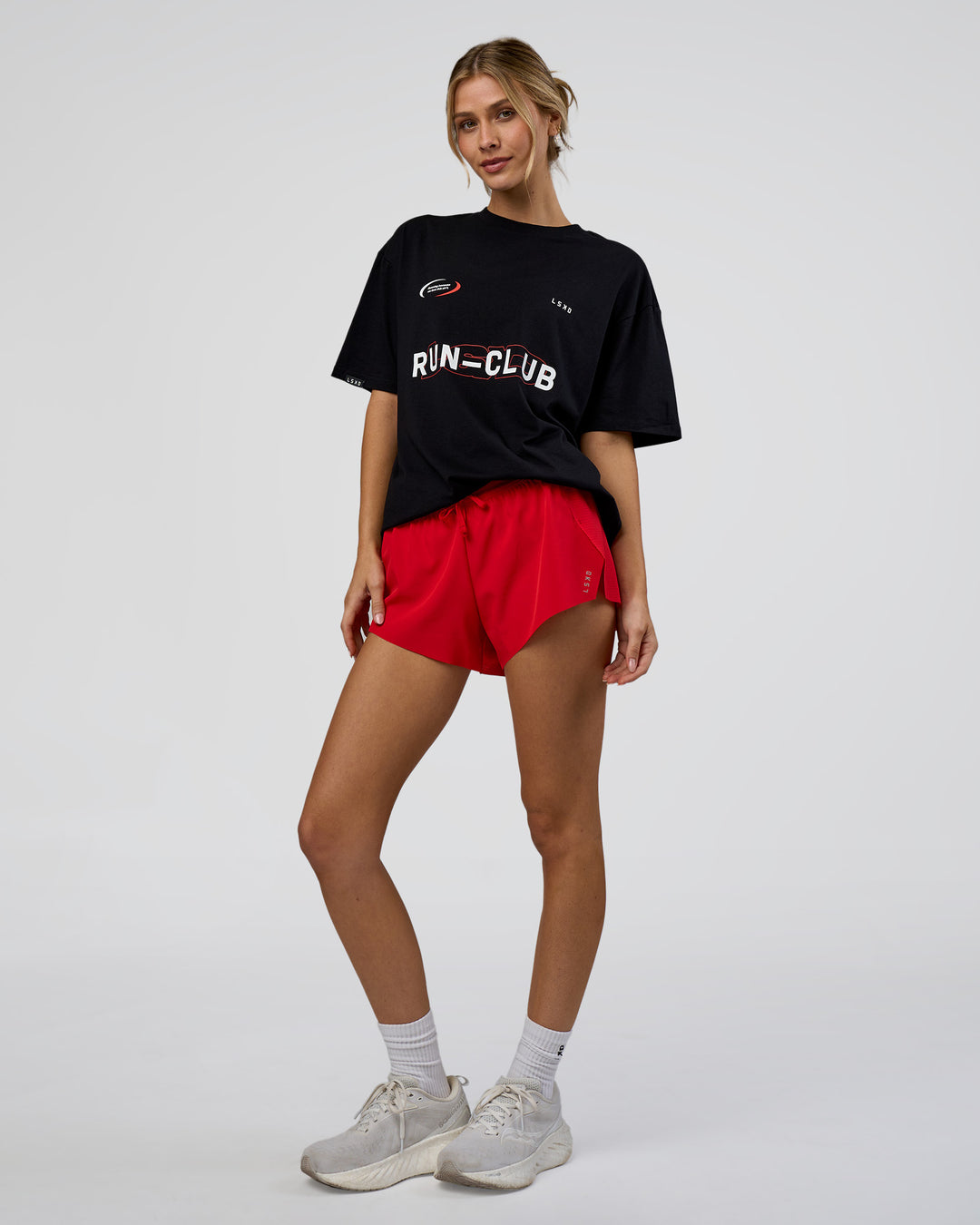 Woman wearing LSKD Run Club FLXCotton Oversized Tee - Black-White | Model:Leilani | Size:XS - view 4