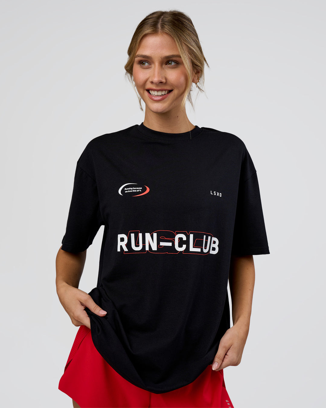 Woman wearing LSKD Run Club FLXCotton Oversized Tee - Black-White | Model:Leilani | Size:XS - view 3