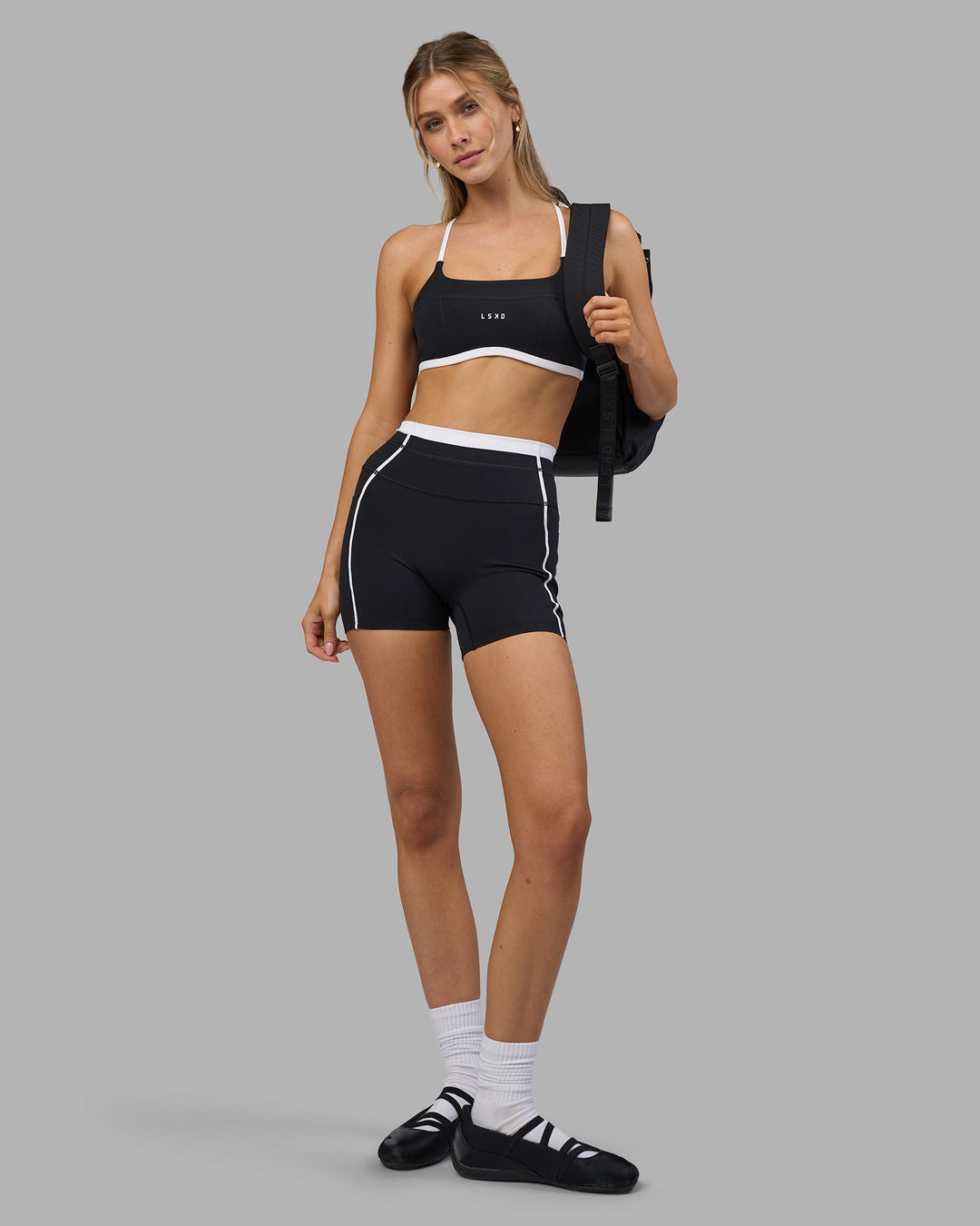 Woman wearing Liberate Contrast High-Rise 4" Short Pockets - Black-White | Model:Leilani | Size:XS - view 7