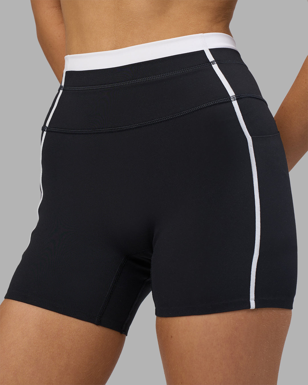 Woman wearing Liberate Contrast High-Rise 4" Short Pockets - Black-White | Model:Leilani | Size:XS - view 3