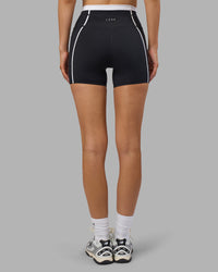Woman wearing Liberate Contrast High-Rise 4" Short Pockets - Black-White | Model:Leilani | Size:XS | Thumbnail Index: 4