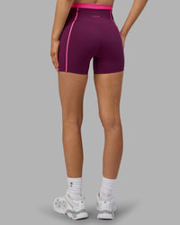 Woman wearing Liberate Contrast High-Rise 4" Short Pockets - Plum Caspia-Ultra Pink | Model:Leilani | Size:XS | Thumbnail Index: 3