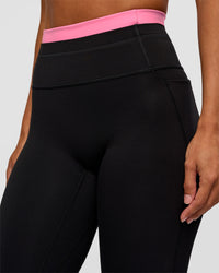 Woman wearing Liberate High-Rise Full Length Legging Pockets - Black-Candy Pink | Model:Brylee | Size:XS | Thumbnail Index: 7