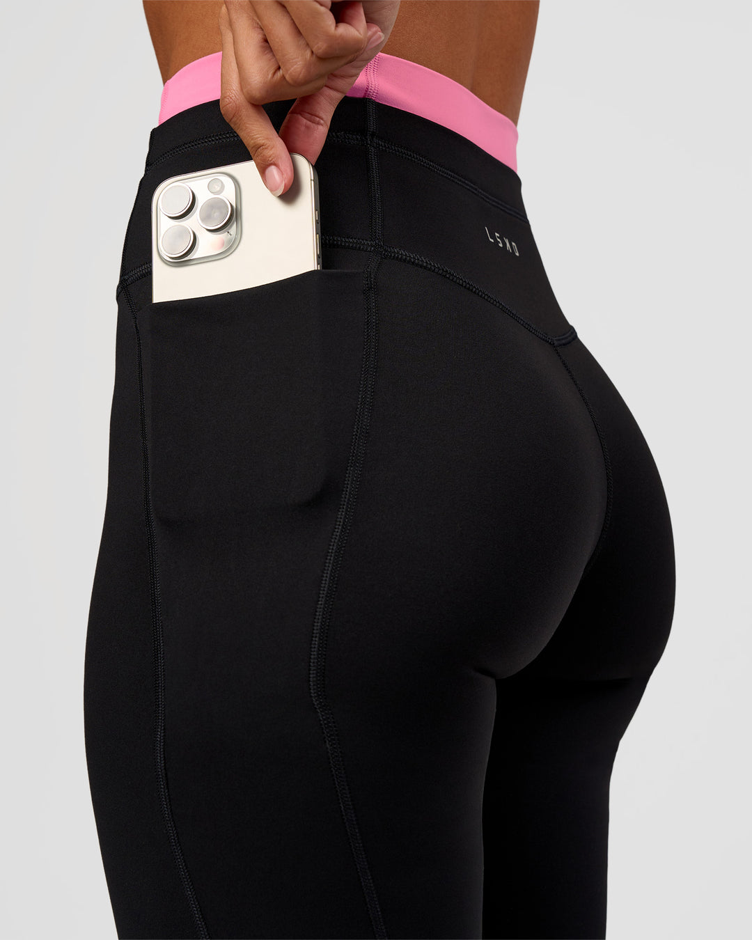 Woman wearing Liberate High-Rise Full Length Legging Pockets - Black-Candy Pink | Model:Brylee | Size:XS - view 3
