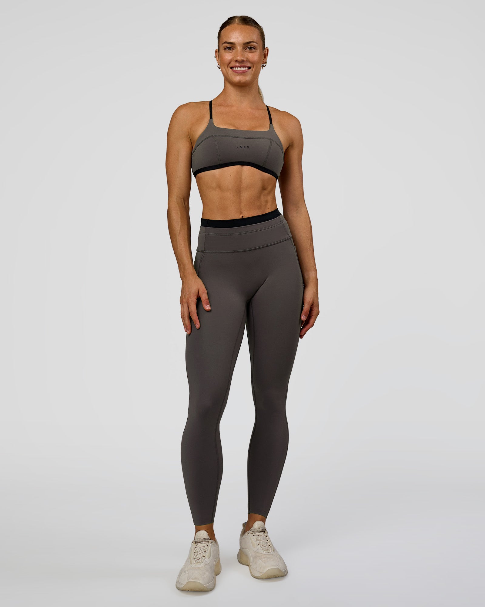 Woman wearing Liberate High-Rise Full Length Legging Pockets in Duskstone-Black | Model:Maja | Size:XS