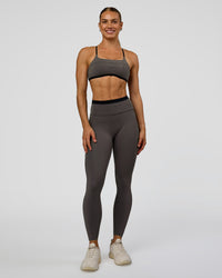 Woman wearing Liberate High-Rise Full Length Legging Pockets in Duskstone-Black | Model:Maja | Size:XS | Thumbnail Index: 0