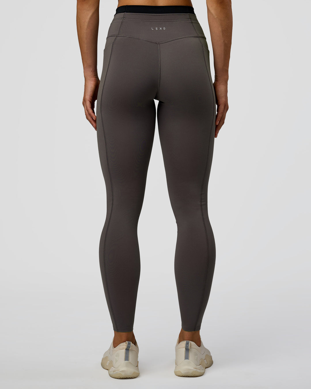 Woman wearing Liberate High-Rise Full Length Legging Pockets in Duskstone-Black | Model:Maja | Size:XS - view 7