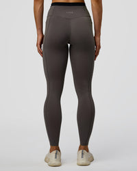 Woman wearing Liberate High-Rise Full Length Legging Pockets in Duskstone-Black | Model:Maja | Size:XS | Thumbnail Index: 6
