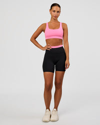 Woman wearing Liberate High-Rise 6" Short Pockets - Black-Candy Pink | Model:Brylee | Size:XS | Thumbnail Index: 2