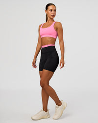 Woman wearing Liberate High-Rise 6" Short Pockets - Black-Candy Pink | Model:Brylee | Size:XS | Thumbnail Index: 3