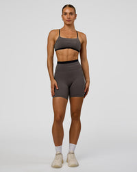 Woman wearing Liberate High-Rise 6" Short Pockets in Duskstone-Black | Model:Maja | Size:XS | Thumbnail Index: 2