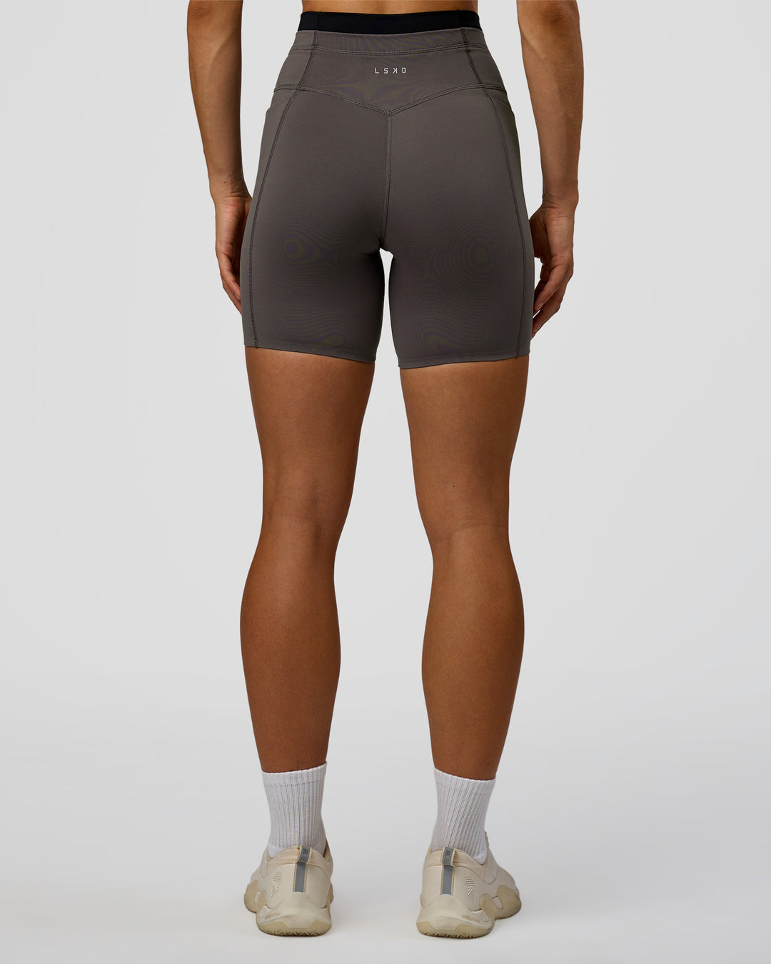 Woman wearing Liberate High-Rise 6" Short Pockets in Duskstone-Black | Model:Maja | Size:XS - view 7
