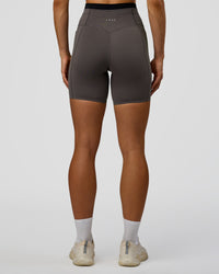 Woman wearing Liberate High-Rise 6" Short Pockets in Duskstone-Black | Model:Maja | Size:XS | Thumbnail Index: 6