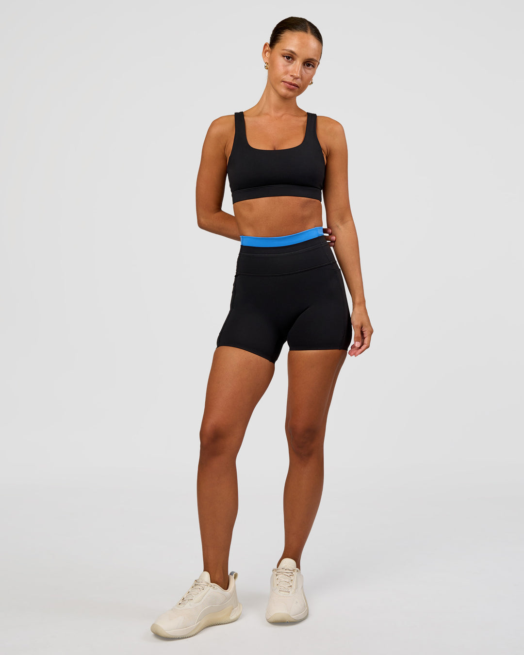 Woman wearing Liberate High-Rise 4" Short Pockets - Black-Palace Blue | Model:Brylee | Size:XS - view 3