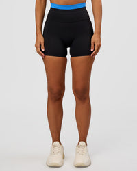 Woman wearing Liberate High-Rise 4" Short Pockets - Black-Palace Blue | Model:Brylee | Size:XS | Thumbnail Index: 4