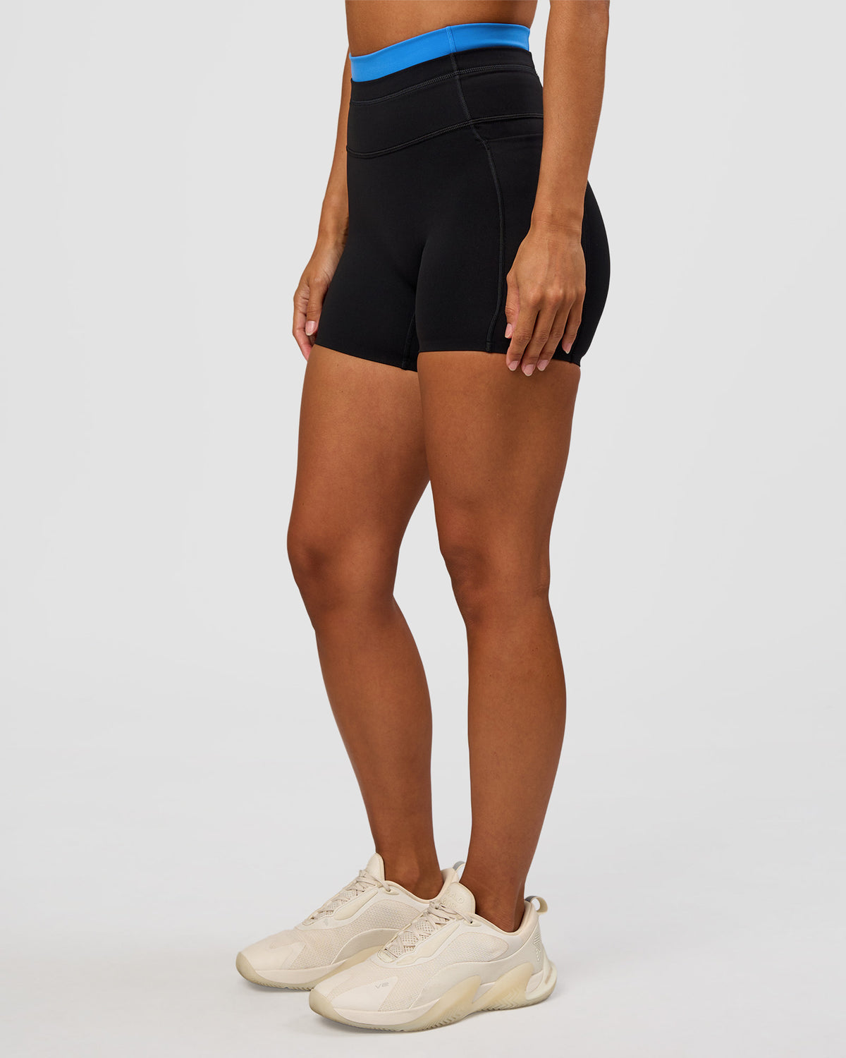 Woman wearing Liberate High-Rise 4" Short Pockets - Black-Palace Blue | Model:Brylee | Size:XS