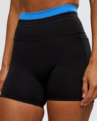 Woman wearing Liberate High-Rise 4" Short Pockets - Black-Palace Blue | Model:Brylee | Size:XS | Thumbnail Index: 5