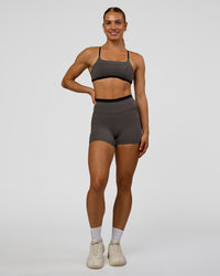 Woman wearing Liberate High-Rise 4" Short Pockets in Duskstone-Black | Model:Maja | Size:XS | Thumbnail Index: 3