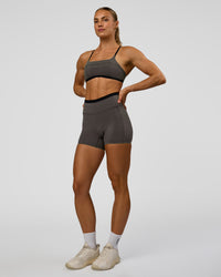Woman wearing Liberate High-Rise 4" Short Pockets in Duskstone-Black | Model:Maja | Size:XS | Thumbnail Index: 4