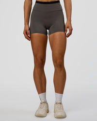 Woman wearing Liberate High-Rise 4" Short Pockets in Duskstone-Black | Model:Maja | Size:XS | Thumbnail Index: 5