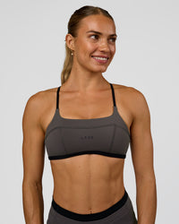 Woman wearing Liberate Sports Bra in Duskstone-Black | Model:Maja | Size:XS | Thumbnail Index: 0