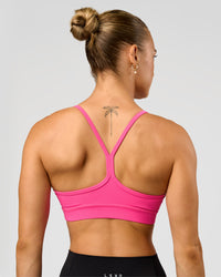 Woman wearing Lift Sports Bra - Ultra Pink | Model:Maja | Size:XS | Thumbnail Index: 1